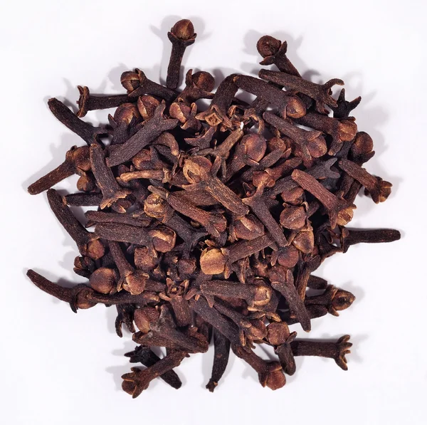 Heap of dried clove on a white — Stock Photo, Image