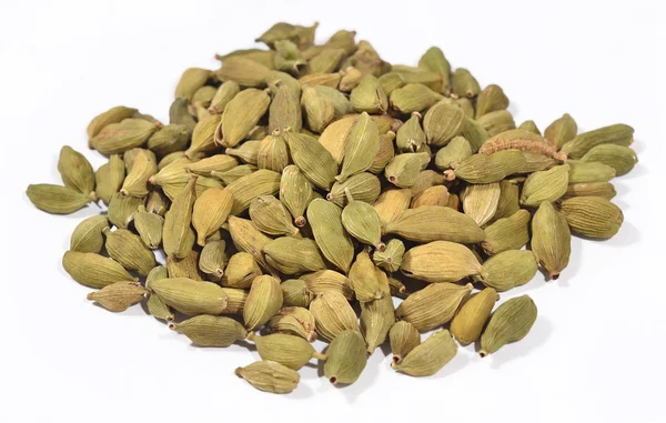 Heap of cardamom seeds on a white — Stock Photo, Image