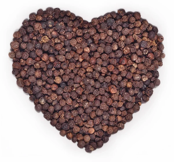 Black pepper in the form of heart on a white — Stock Photo, Image