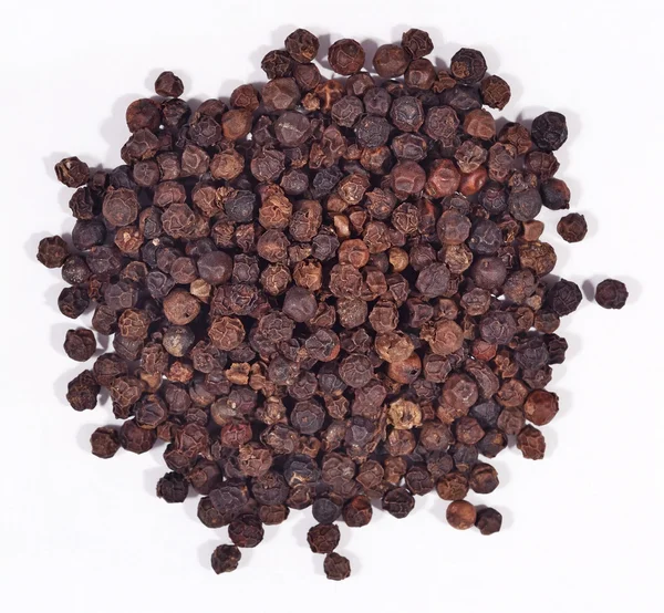 Heap of black pepper on a white — Stock Photo, Image