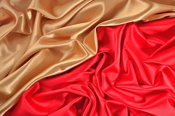 Altın ve kırmızı saten kumaştan arka plan — Stok fotoğraf
