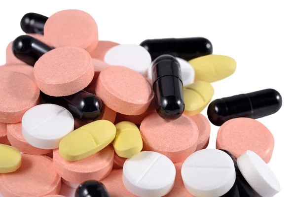 Montón de píldoras de colores en un blanco —  Fotos de Stock