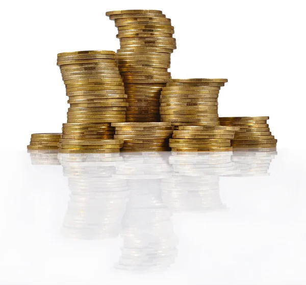 Piles of gold coins on a white — Stock Photo, Image