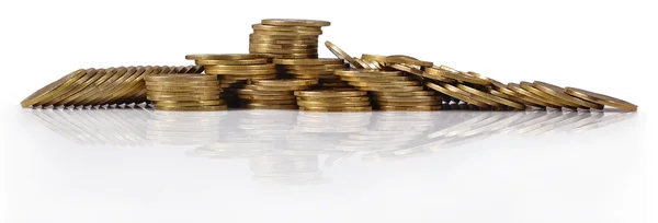 Piles of gold coins on a white — Stock Photo, Image