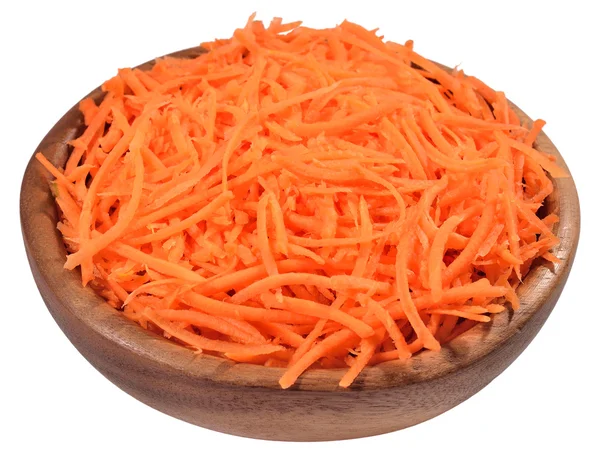 Chopped carrot in a wooden bowl on a white — Stock Photo, Image