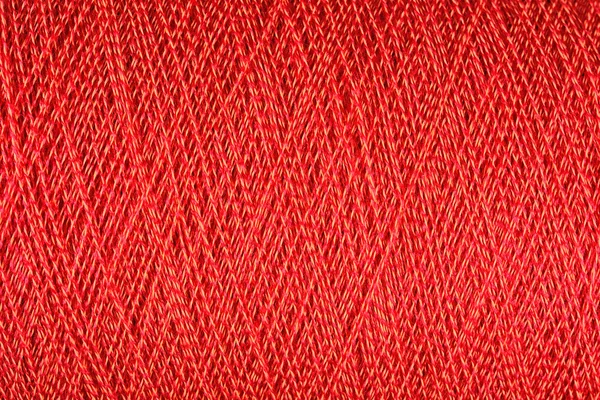 Spool of orange thread macro background — Stock Photo, Image