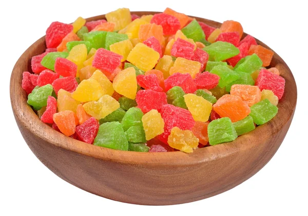 Candied fruits in a wooden bowl on a white — Stock Photo, Image