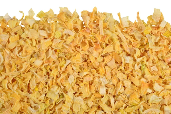 Heap of dried onions on a white