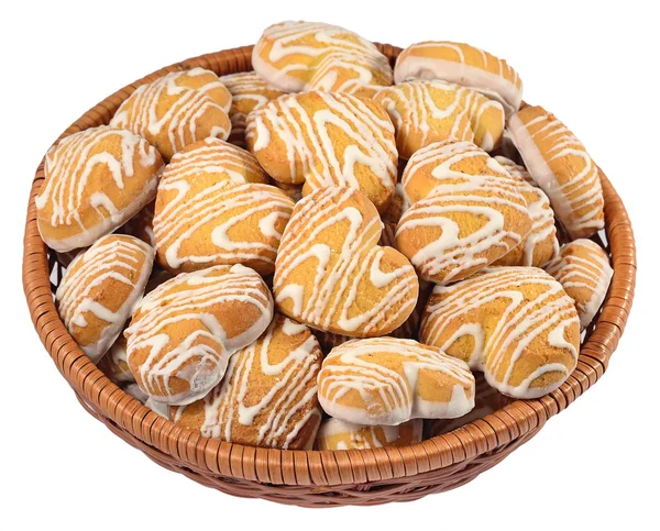 Cookies in heart shape in a wicker bowl on a white — Stock Photo, Image