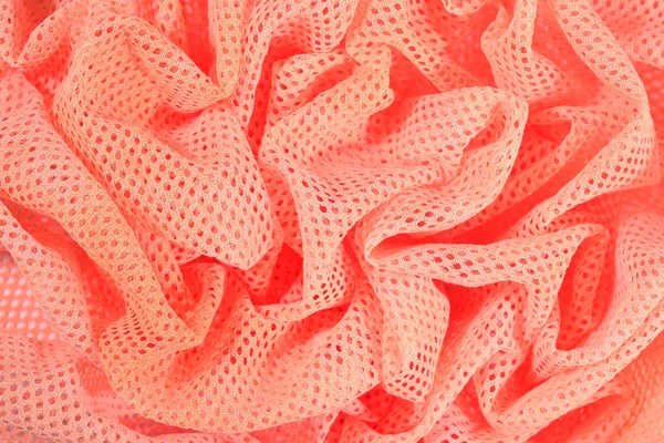 Orange crumpled nonwoven fabric background — Stock Photo, Image