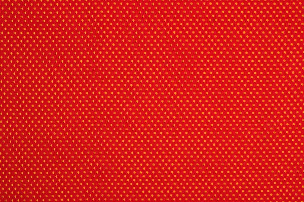 Röd icke vävda tyg på en gul — Stockfoto