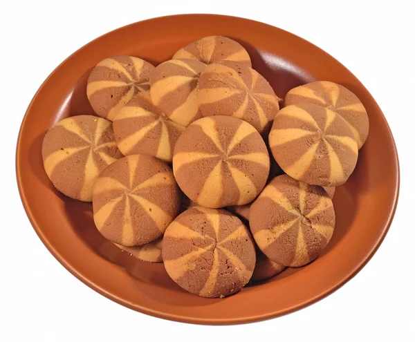 Sweet round cookies on a ceramic plate on a white — Stock Photo, Image