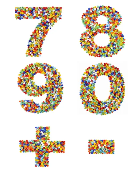 Numbers 7 through 0 and punctuation marks made from colorful gla — Stock Photo, Image