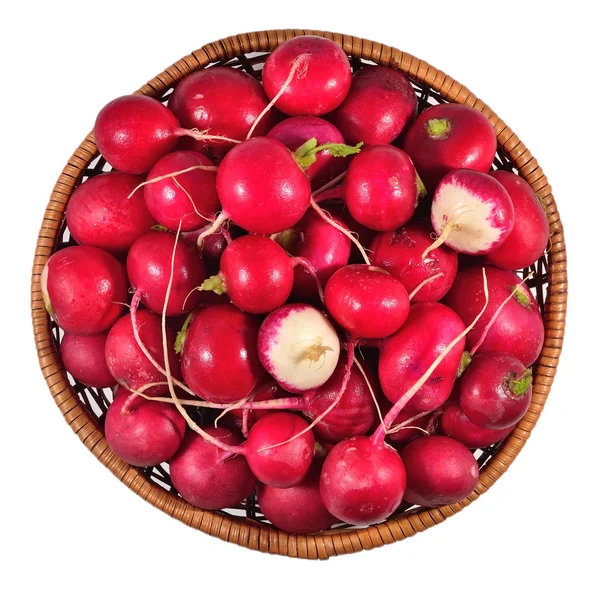 Red radish in a wicker bowl on a white — Stock Photo, Image