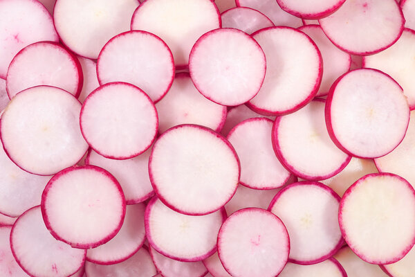 Red sliced radish background 