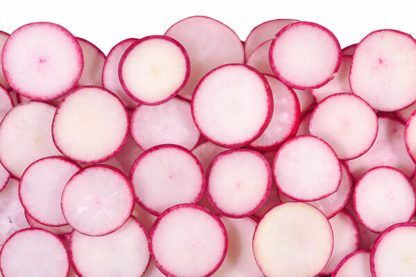 Red sliced radish on a white 