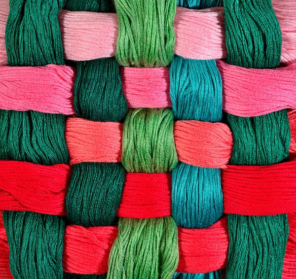 Colorful twisted skeins of floss as background texture — Stock Photo, Image