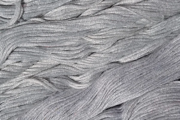 Gray embroidery floss as background texture — Stock Photo, Image