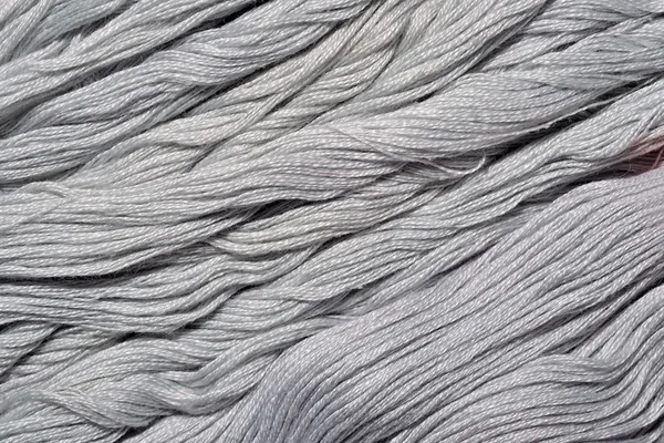 背景テクスチャとしてグレーの刺繍糸 — ストック写真