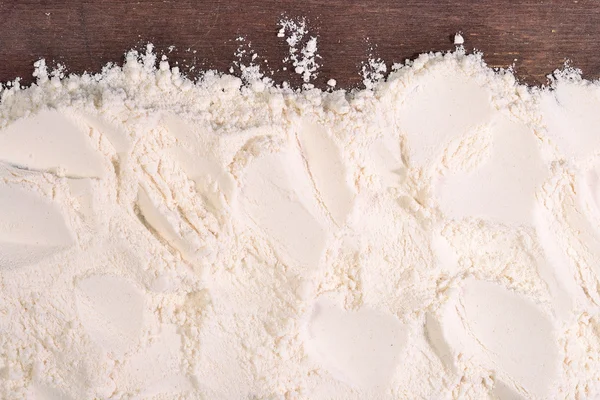 White flour on a wooden background — Stock Photo, Image