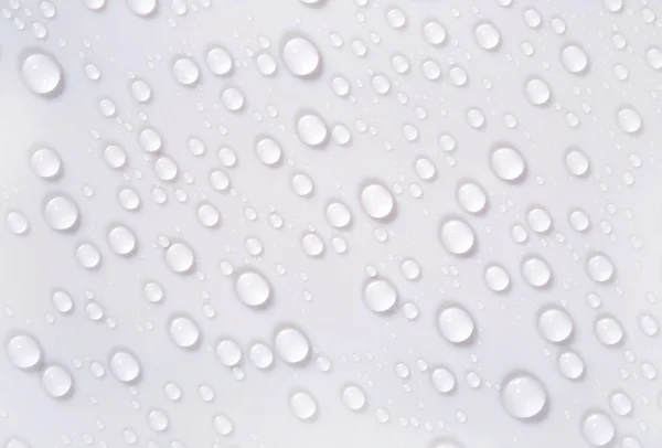 Water drops on the white surface — Stock Photo, Image