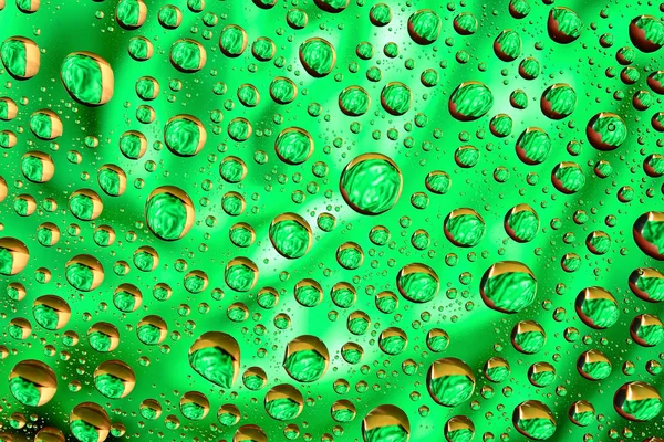 Gotas de agua sobre fondo verde —  Fotos de Stock