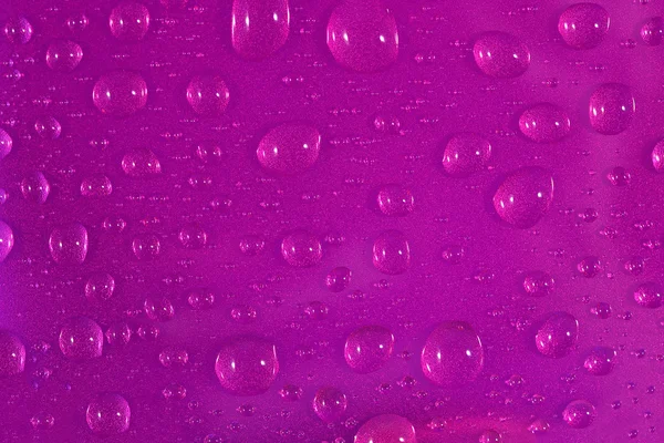 Water drops on pink background — Stock Photo, Image