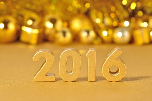 2016 year golden figures and golden Christmas decorations — Stock Photo, Image