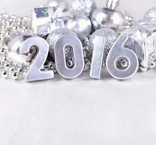 2016 year silver figures and silvery Christmas decorations — Stock Photo, Image