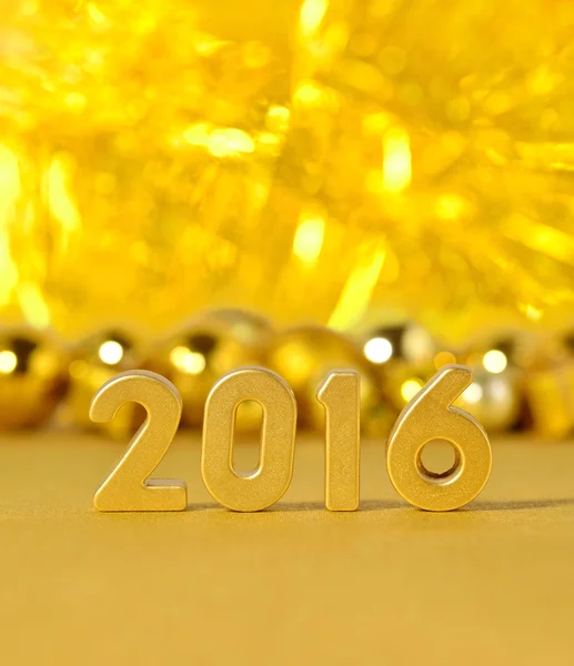 2016 year golden figures and golden Christmas decorations — Stock Photo, Image