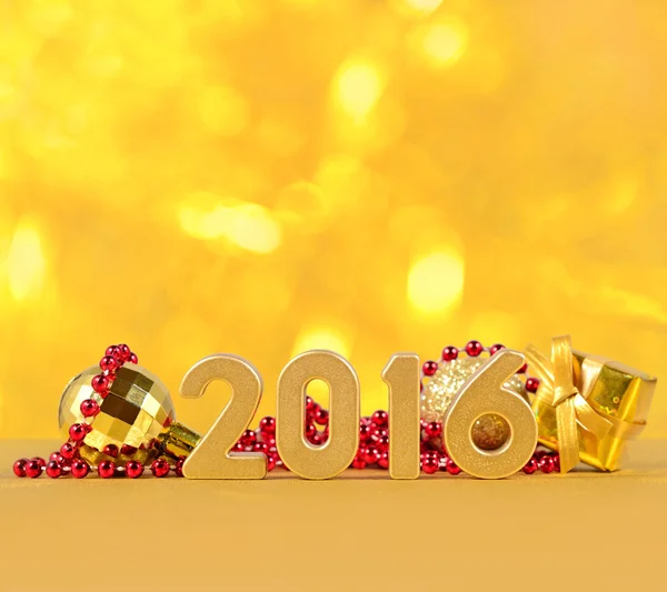 2016 figuras de ouro ano e decorações de Natal — Fotografia de Stock