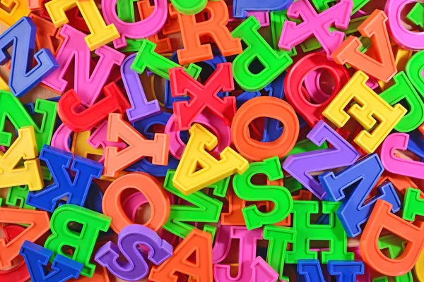 Colorful plastic alphabet letters as background — Stock Photo, Image