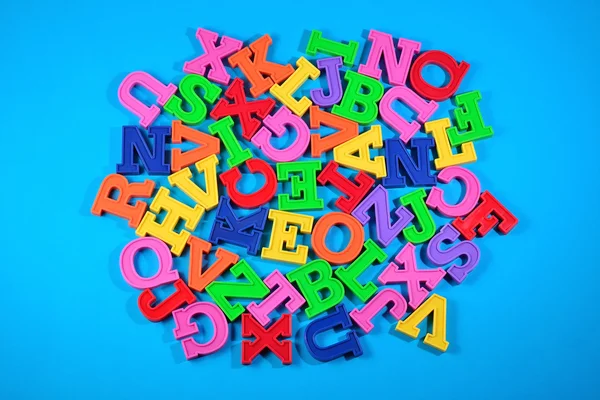 Heap of plastic colored alphabet letters — Stock Photo, Image