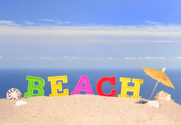 Strand Buchstaben auf einem Strand Sand — Stockfoto