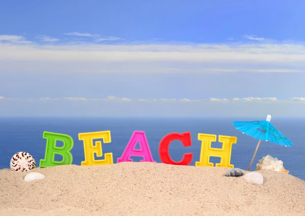 Lettere di spiaggia su una sabbia di spiaggia — Foto Stock