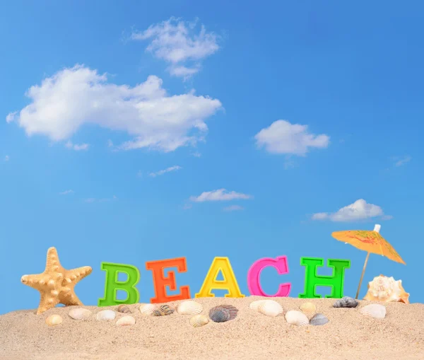 Strand Buchstaben auf einem Strand Sand — Stockfoto