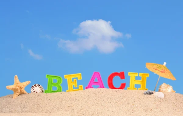 Strand Buchstaben auf einem Strand Sand — Stockfoto