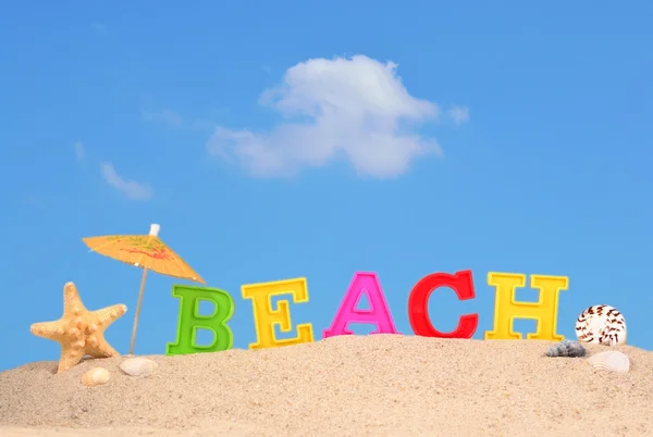 Strand Buchstaben auf einem Strand Sand — Stockfoto