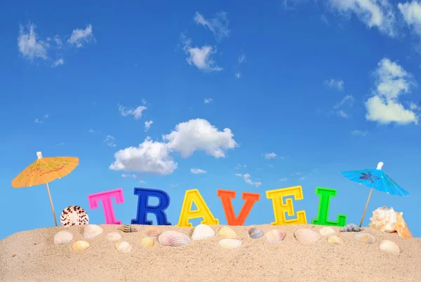 Travel letters on a beach sand — Stock Photo, Image