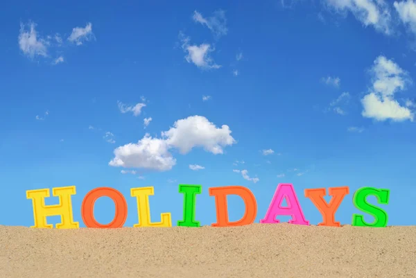 Litery wakacje na plaży piasek — Zdjęcie stockowe