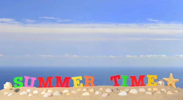 Summer time letters on a beach sand — Stock Photo, Image