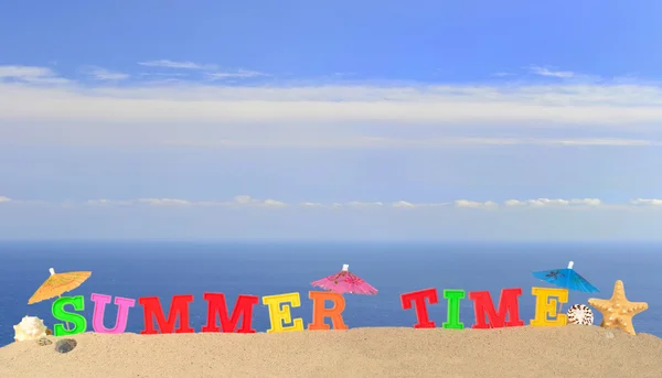 Summer time letters on a beach sand — Stock Photo, Image