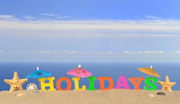 Vakantie letters op een strand-zand — Stockfoto