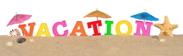 Letras de vacaciones en una playa de arena en un blanco — Foto de Stock