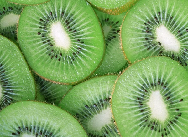 Beautiful kiwi fruit slices background — Stock Photo, Image