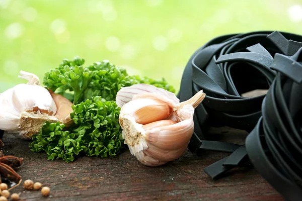 Kitchen simple still life of pasta and garlic herb — Stock Photo, Image