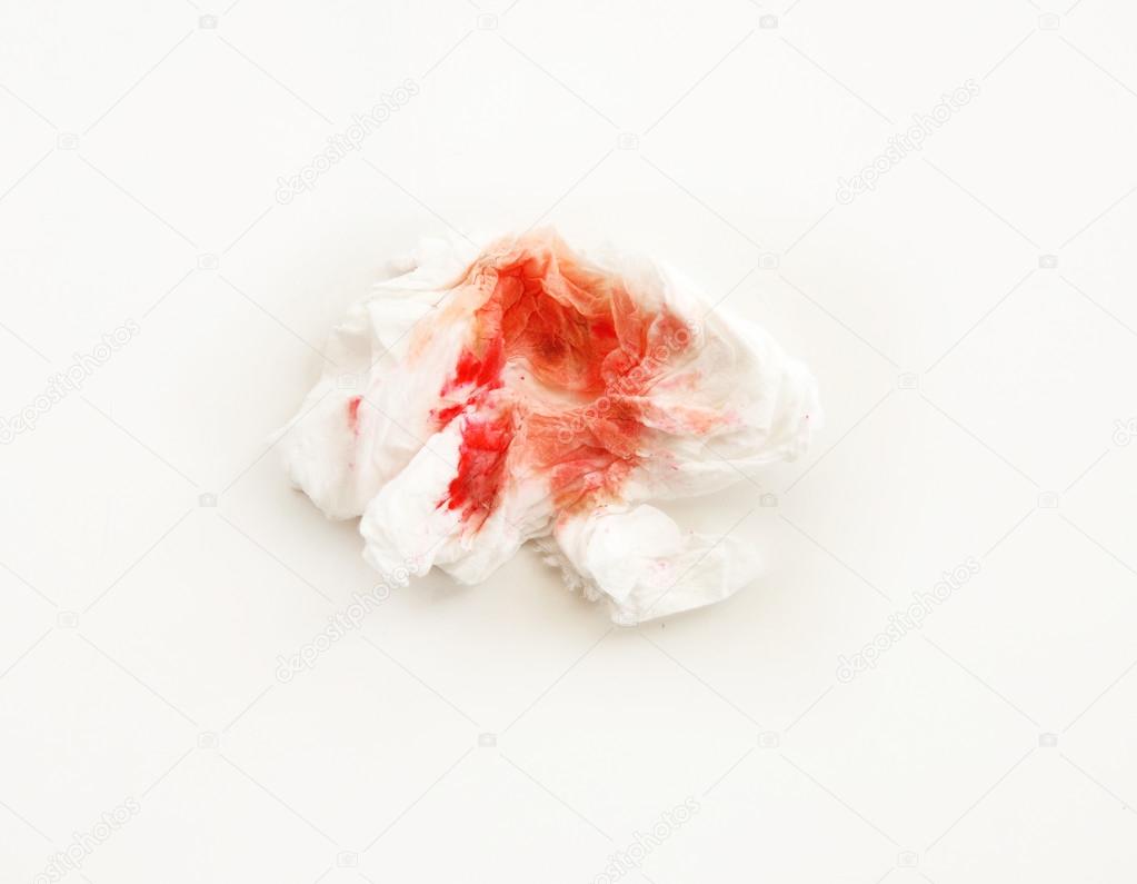 Blood on tissue on white background
