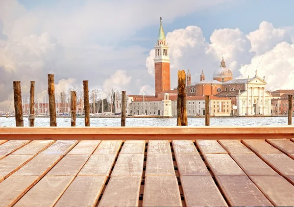 Basilica Santa Maria della Salute, Venice, Italy and wooden surface — Stock Photo, Image