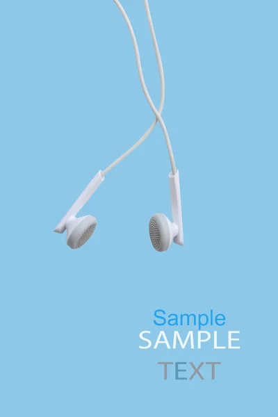 Białe słuchawki za pomocą cyfrowej muzyki lub inteligentny telefon (ścieżki przycinającej) — Zdjęcie stockowe