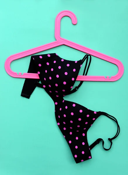 Summer concept, bra on coat hanger on blue. (Pop art style) — Stock Photo, Image